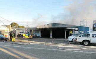 All smoked up: Firefighters battle the blaze that broke out at Marcia Street Wreckers. All smoked up: Firefighters battle the blaze that broke out at Marcia Street Wreckers.